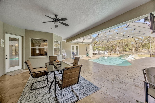 4411 Culbreath Rd, Valrico, FL 33596 - view of patio / terrace with outdoor dining space, an outdoor pool, ceiling fan, french doors, and a lanai