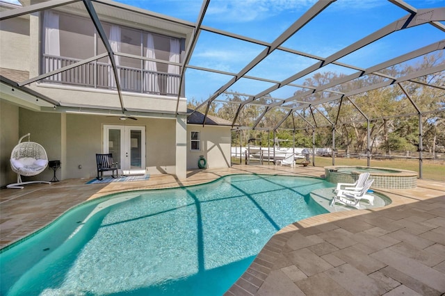 4411 Culbreath Rd, Valrico, FL 33596 - view of swimming pool with french doors, a pool with connected hot tub, a ceiling fan, and a patio area