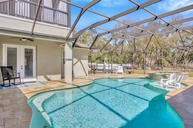 4411 Culbreath Rd, Valrico, FL 33596 - view of swimming pool with glass enclosure, a pool with connected hot tub, ceiling fan, french doors, and a patio area