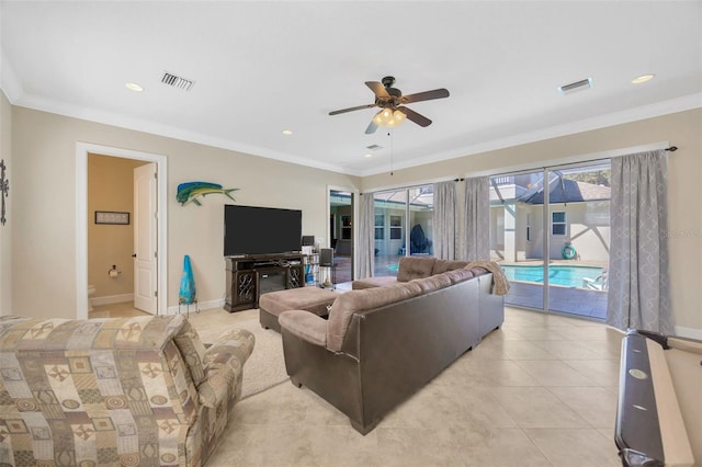 4411 Culbreath Rd, Valrico, FL 33596 - living room with light tile patterned flooring, visible vents, crown molding, and baseboards