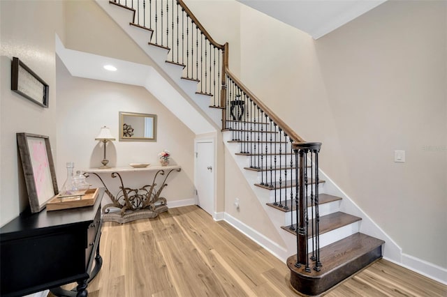 4411 Culbreath Rd, Valrico, FL 33596 - staircase featuring a high ceiling, recessed lighting, wood finished floors, and baseboards