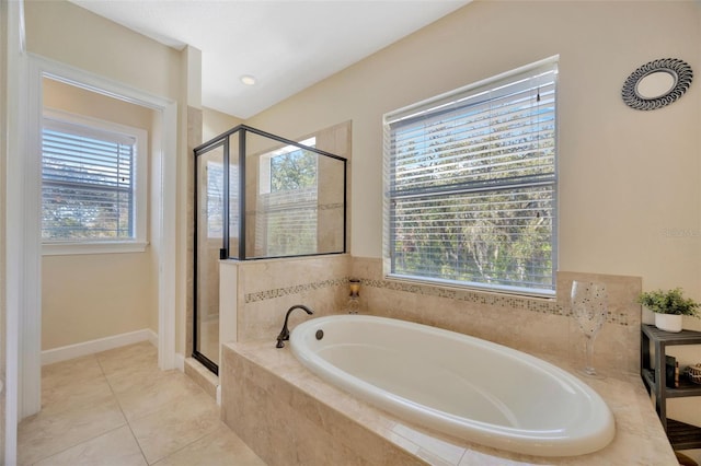 4411 Culbreath Rd, Valrico, FL 33596 - bathroom featuring tile patterned floors, a stall shower, baseboards, and a garden tub