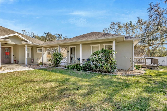 4411 Culbreath Rd, Valrico, FL 33596 - single story home with stucco siding, roof with shingles, covered porch, and a front yard