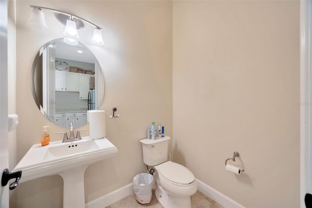 4411 Culbreath Rd, Valrico, FL 33596 - bathroom featuring tile patterned flooring, toilet, and baseboards