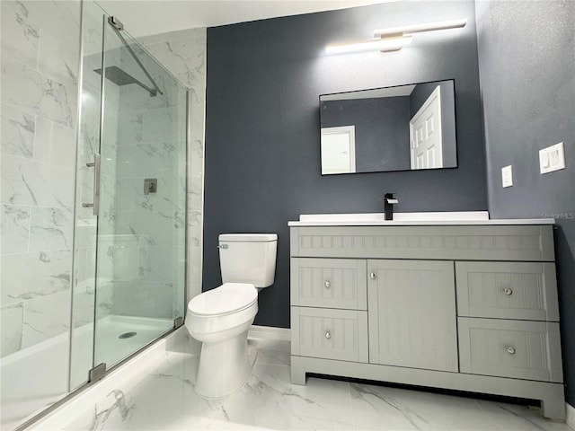 bathroom with a marble finish shower, toilet, marble finish floor, and vanity