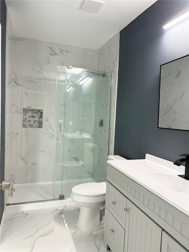 full bathroom featuring a marble finish shower, visible vents, toilet, marble finish floor, and vanity