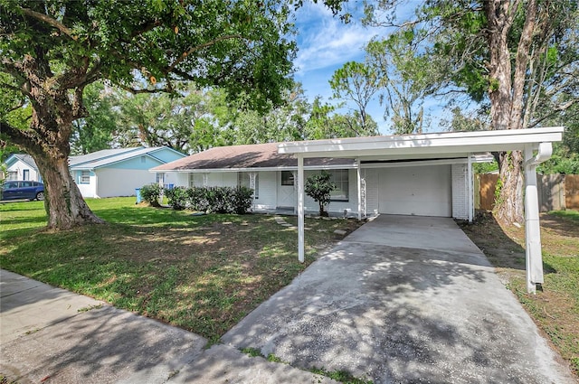 ranch-style house featuring concrete driveway, an attached carport, fence, a front lawn, and brick siding