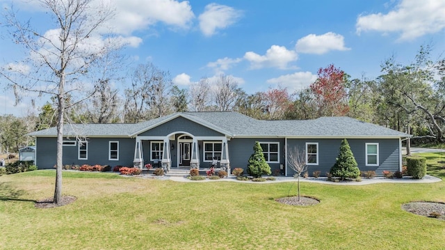 single story home featuring a front lawn