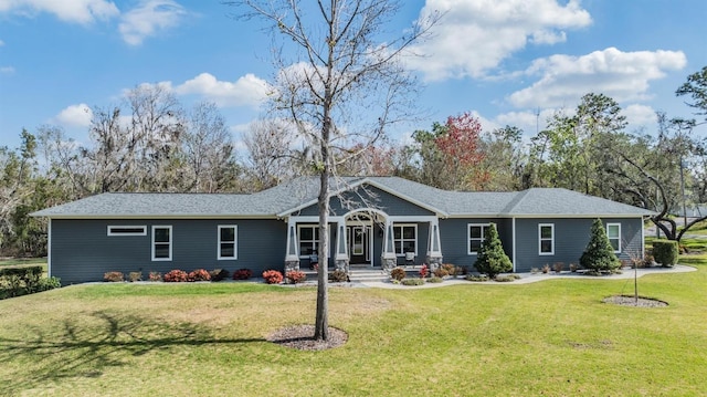 single story home featuring a front yard