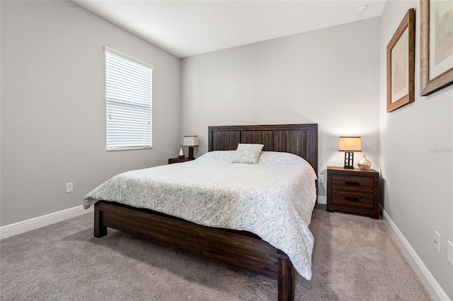 bedroom with carpet flooring and baseboards