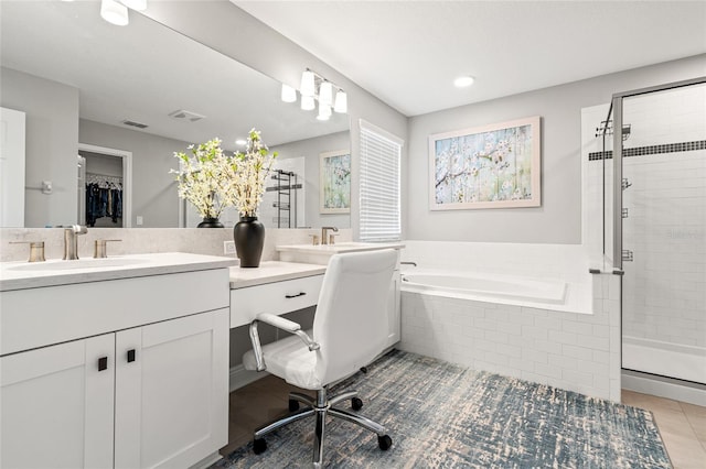 bathroom featuring a stall shower, visible vents, a bath, and tile patterned floors