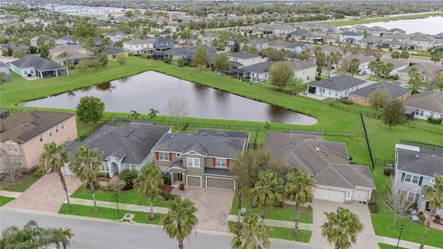 bird's eye view featuring a residential view and a water view