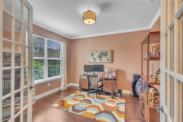 office space with crown molding, baseboards, and wood finished floors