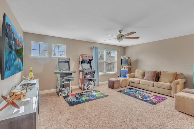 game room featuring a ceiling fan, carpet, and baseboards