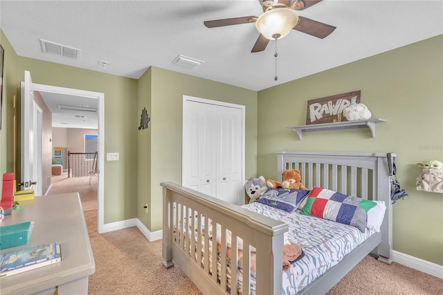 bedroom featuring ceiling fan, visible vents, baseboards, a closet, and carpet