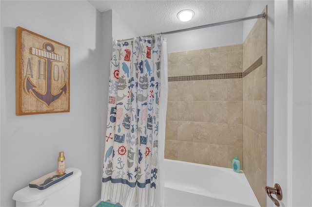 bathroom featuring a textured ceiling, shower / tub combo, and toilet