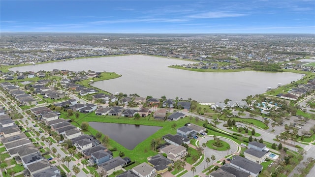 drone / aerial view featuring a water view and a residential view