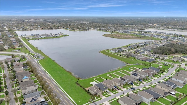 aerial view with a residential view and a water view