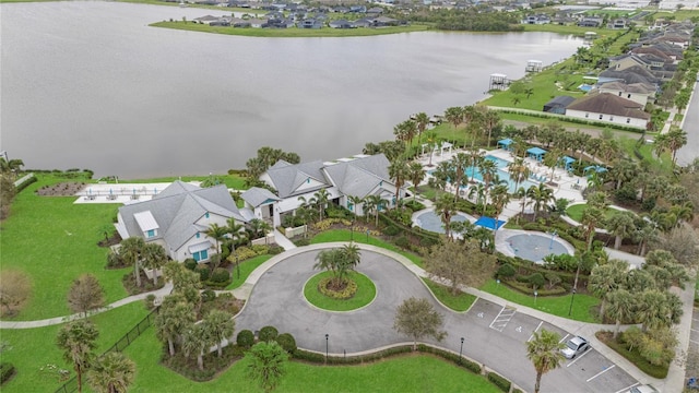 bird's eye view with a residential view and a water view