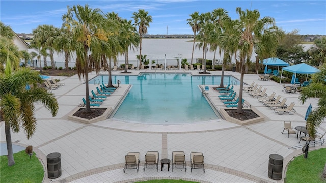 pool with central AC, a patio area, and fence