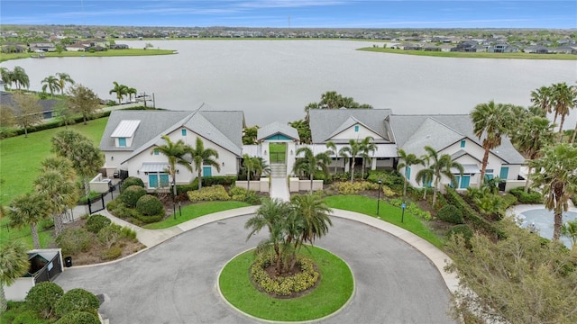 aerial view with a residential view and a water view