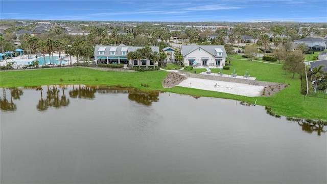 drone / aerial view featuring a water view and a residential view