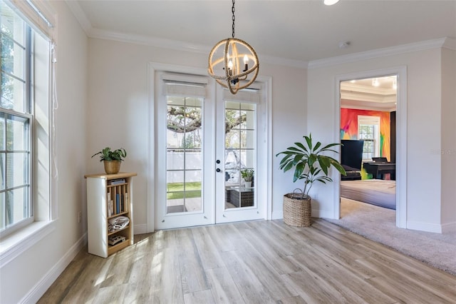 entryway with baseboards, wood finished floors, and crown molding