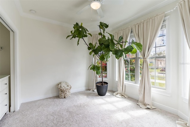 unfurnished sunroom with ceiling fan