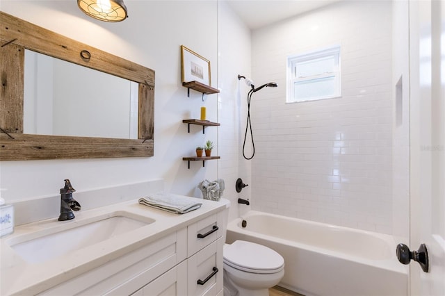 full bathroom featuring toilet, washtub / shower combination, and vanity