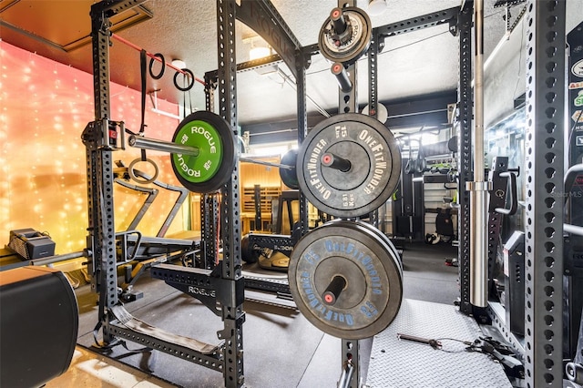 workout area featuring a textured ceiling