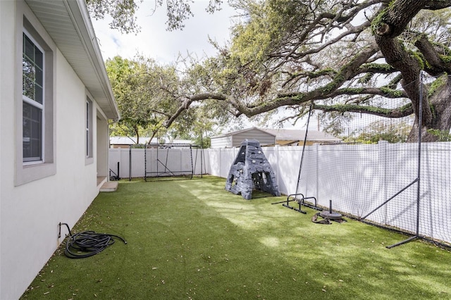 view of yard with a fenced backyard