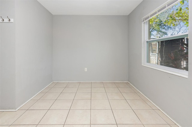 empty room with light tile patterned floors