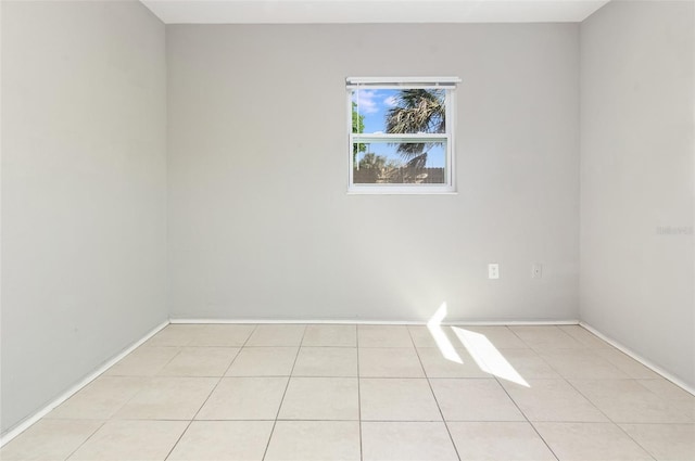 spare room with light tile patterned floors