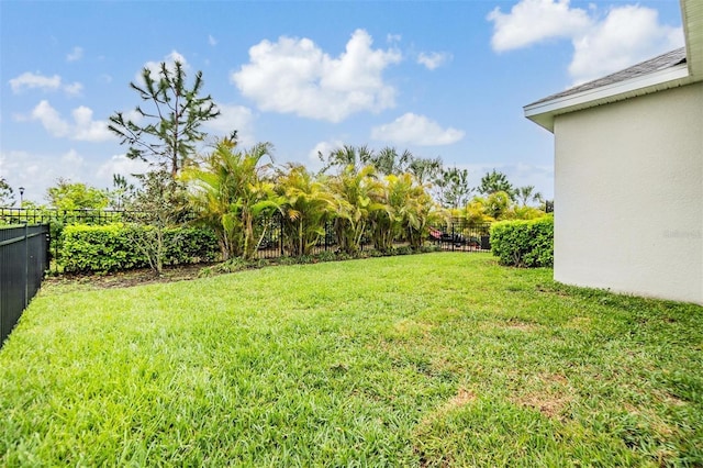 view of yard featuring fence