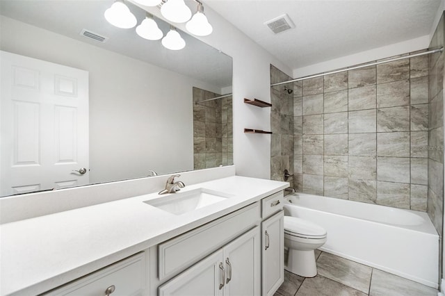 full bathroom with visible vents, tub / shower combination, toilet, and vanity