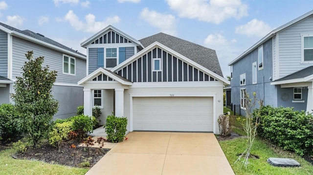 view of front of home featuring stucco siding, a garage, driveway, and roof with shingles