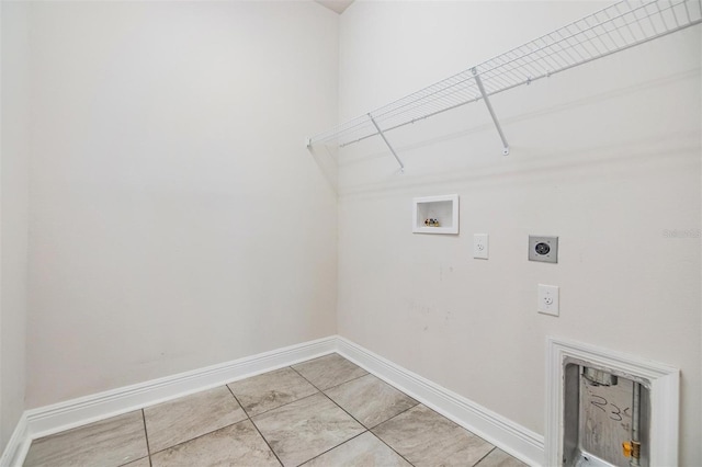 laundry area featuring baseboards, hookup for an electric dryer, washer hookup, and laundry area