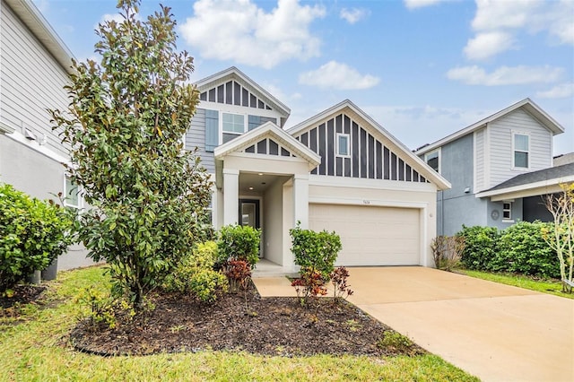 view of front of property with concrete driveway, a garage, and stucco siding