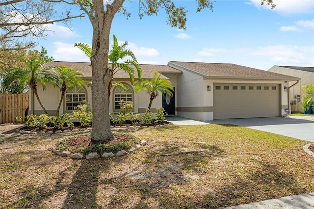 view of front of home with a garage, a shingled roof, fence, concrete driveway, and stucco siding