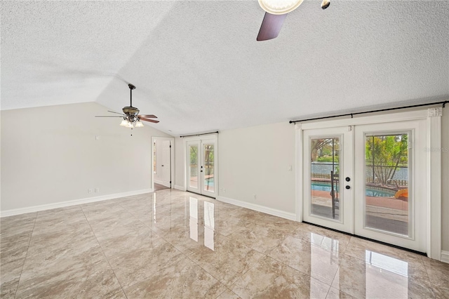 unfurnished living room with french doors, lofted ceiling, a ceiling fan, a textured ceiling, and baseboards