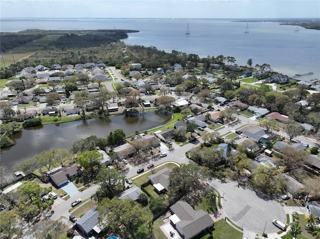 bird's eye view with a water view and a residential view