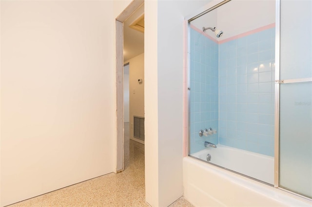 bathroom with shower / bathtub combination, speckled floor, and visible vents