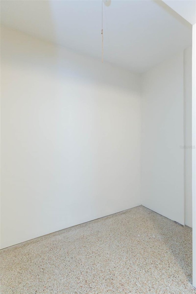 empty room with speckled floor