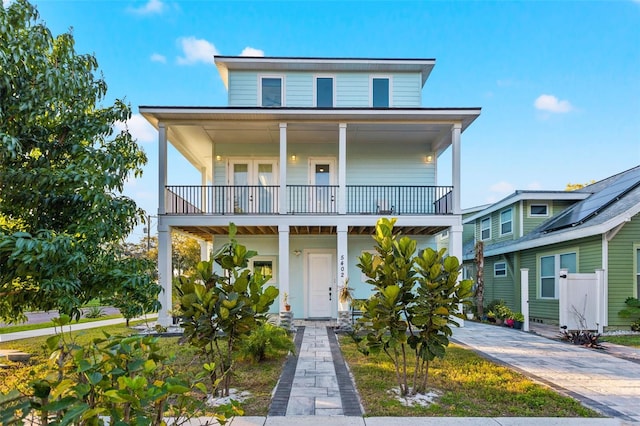 coastal home featuring covered porch