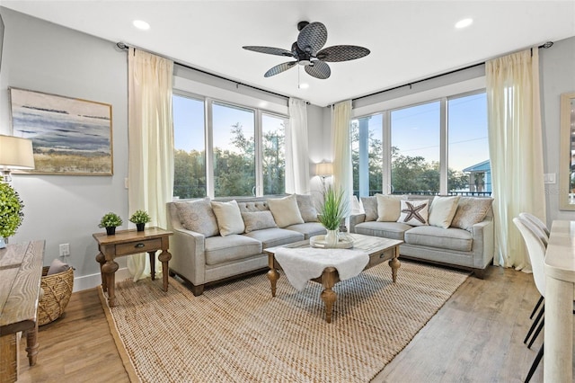 sunroom / solarium with ceiling fan