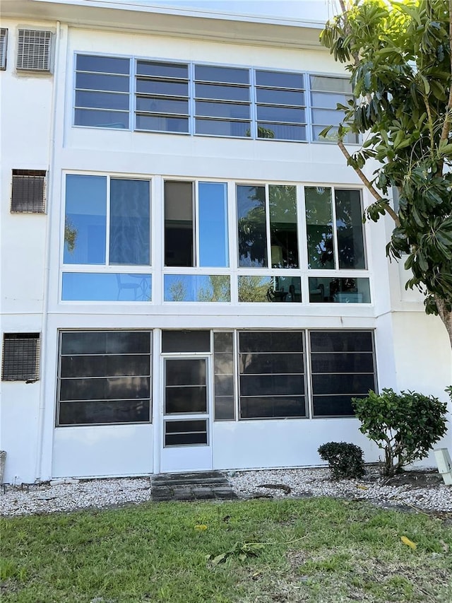 exterior space featuring stucco siding