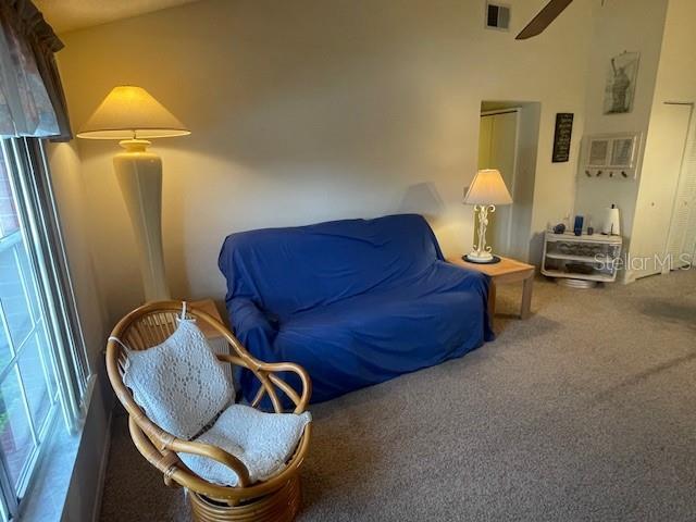 sitting room featuring carpet floors and visible vents