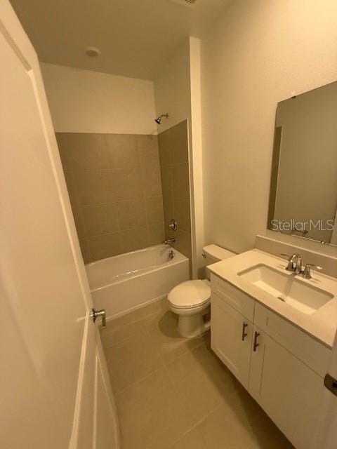 bathroom with toilet, shower / bath combination, vanity, and tile patterned floors