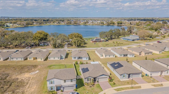 birds eye view of property with a residential view and a water view