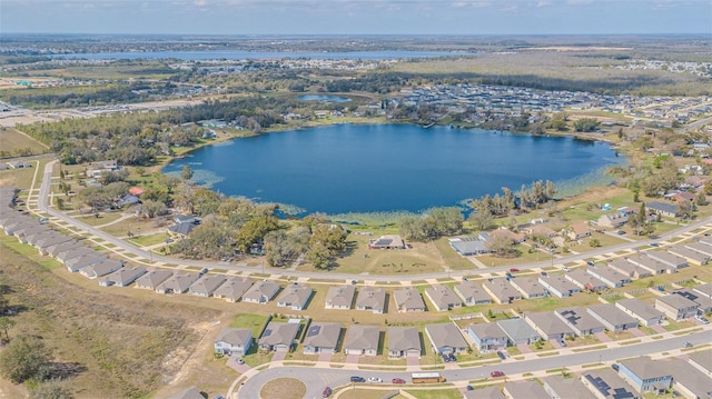 bird's eye view featuring a water view and a residential view